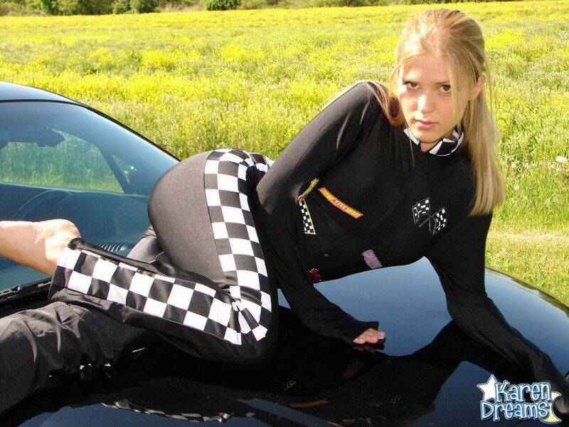 Amateur girl Karen shows some side boob in a racing suit atop a car - #12