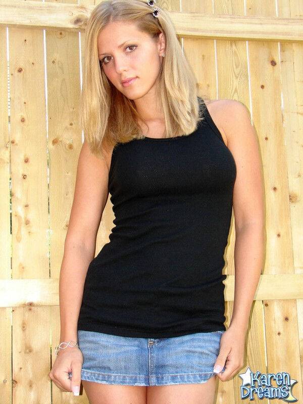 Young blond girl Karen shows her thigh gap during SFW upskirt action in a yard - #8