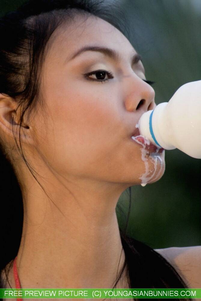 Sexy Asian girl gets milk all over her pretty face and nice breasts - #16