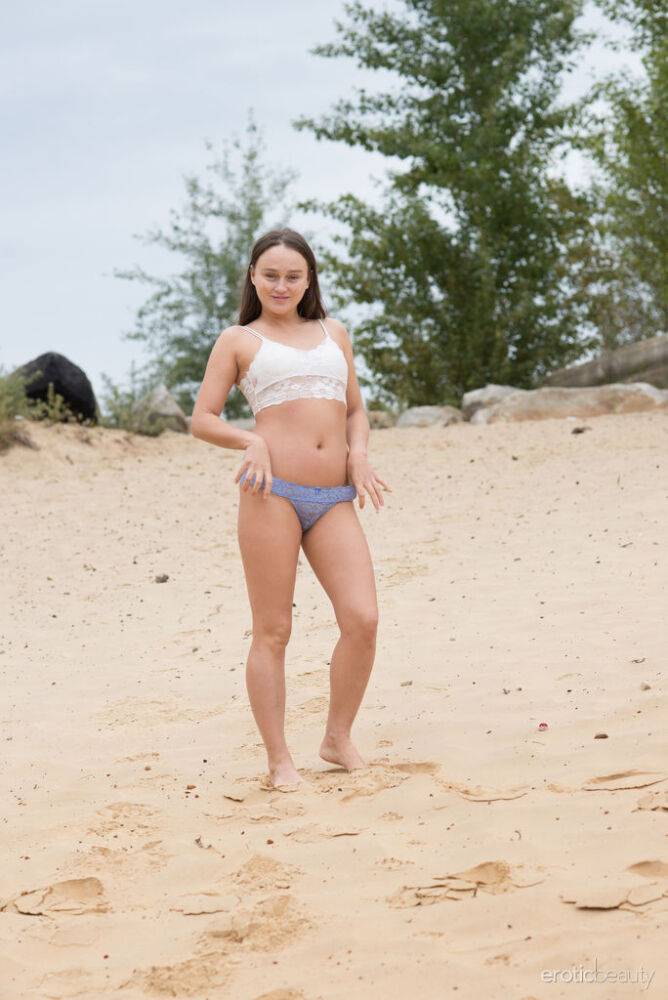 Sweet teen Alice Koks gets butt naked on a sandy beach by herself - #5