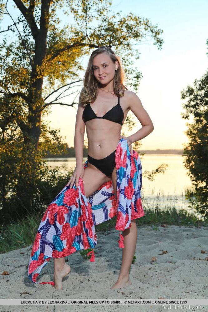 Blonde teen Lucretia K ditches her bikini to get naked on a beach towel - #14