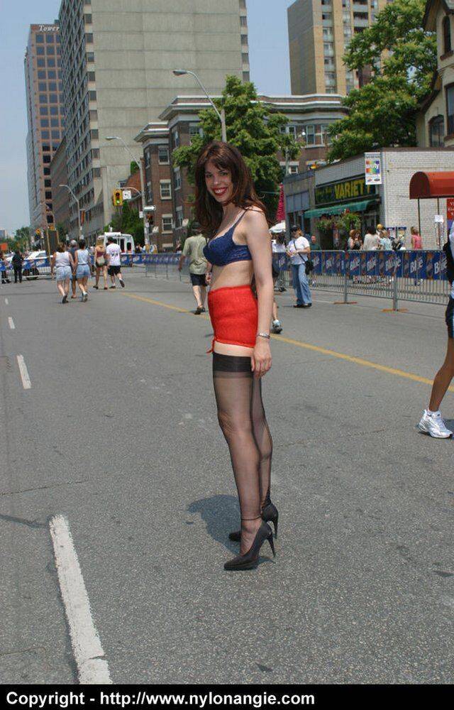 Amateur model wanders a public street in her underthings and a girdle - #6