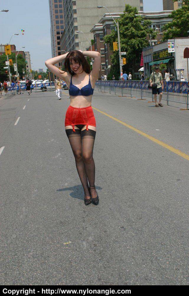 Amateur model wanders a public street in her underthings and a girdle - #1