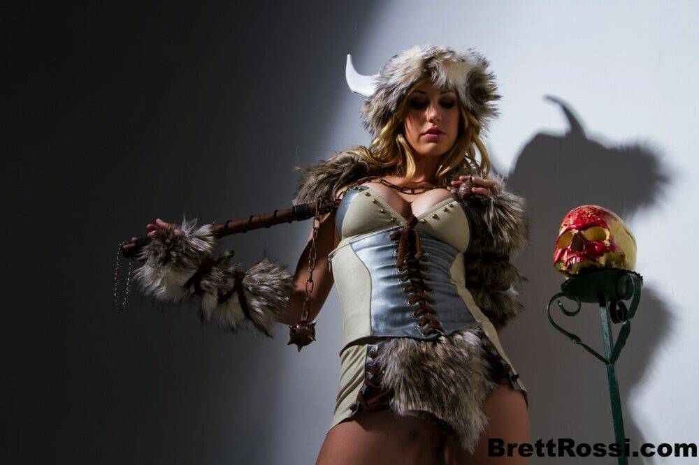 Solo model Brett Rossi frees her big tits and bald pussy from Viking attire - #1