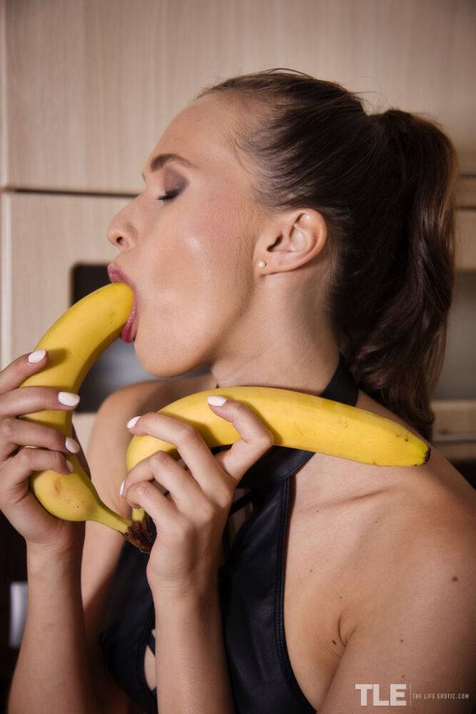 Czech brunette Stacy Cruz takes a playful suck on the ripe bananas, squeezing - #16