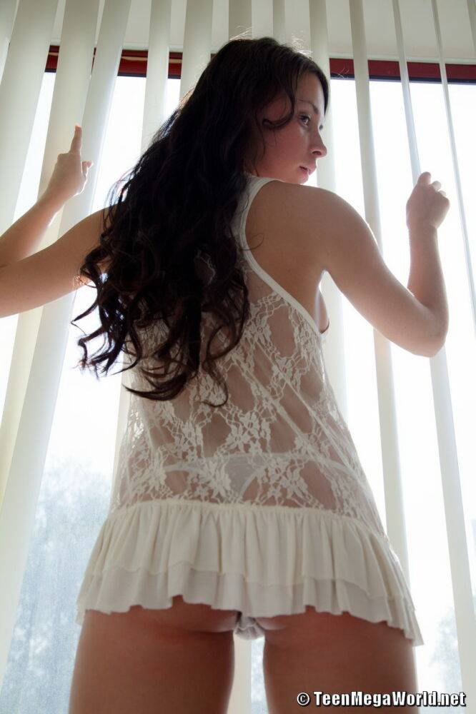 Dark haired teen Zoya strips to white lace socks in front of window blinds - #14