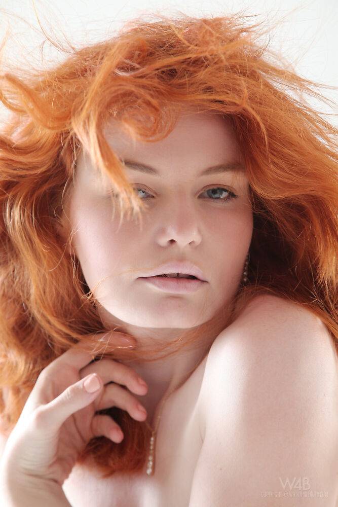 Pale redhead teen Barbara Babeurre slips off her white dress to model naked - #1