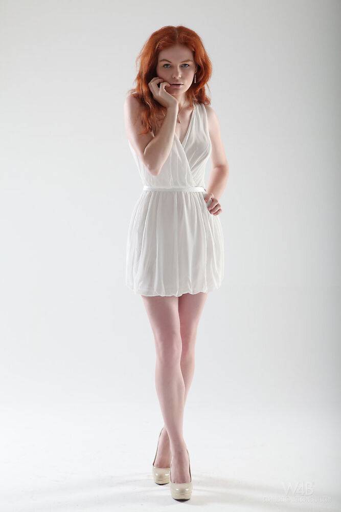 Pale redhead teen Barbara Babeurre slips off her white dress to model naked - #13