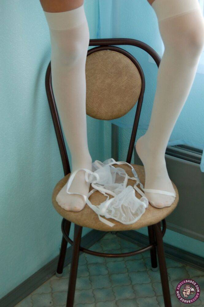 Thin brunette strips to white over the knee stockings on kitchen stool - #6