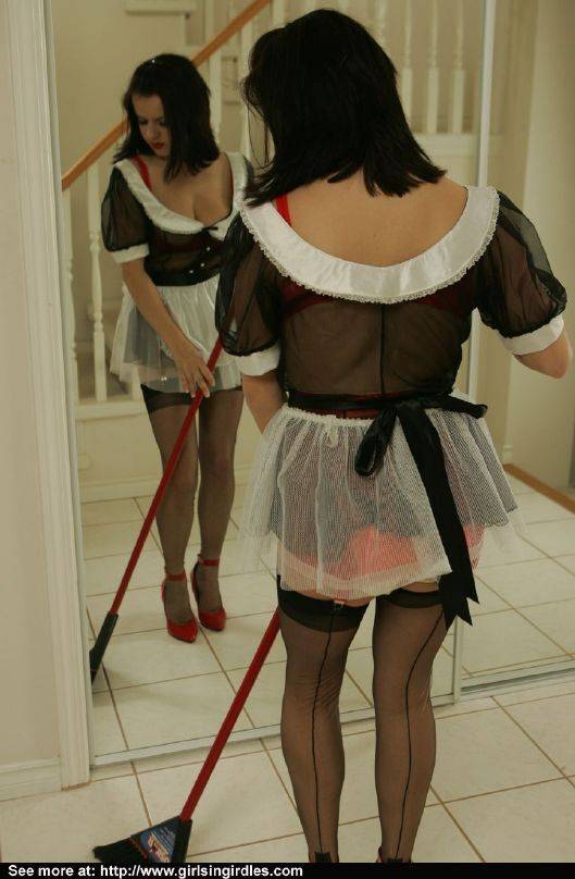 Brunette babe in stockings and maid uniform posing in front of the mirror - #8