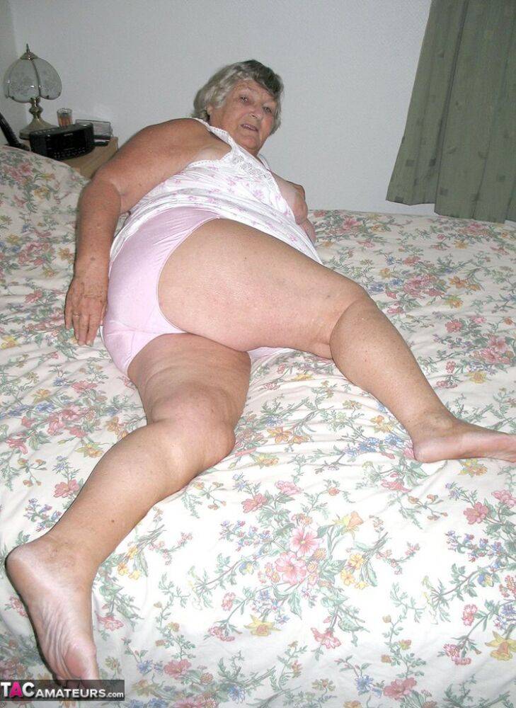 Old woman Grandma Libby grabs her fat roll after getting naked on a bed - #6