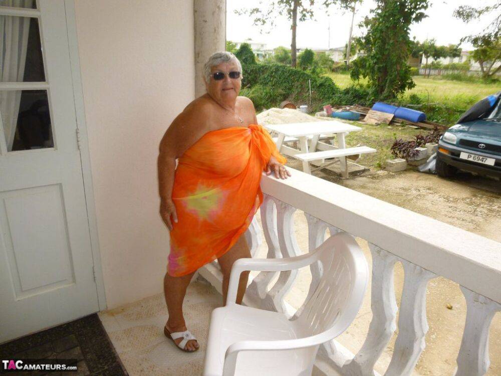 Fat oma Grandma Libby exposes her tan lined body on a balcony - #15