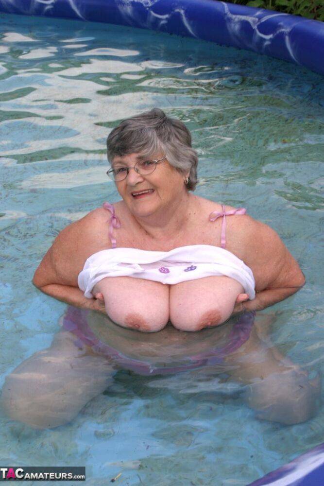 Overweight UK nan Grandma Libby exposes her boobs in a backyard swimming pool - #10