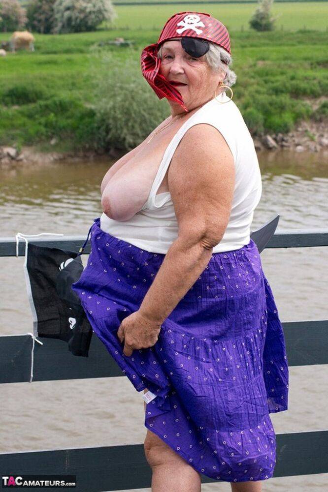 Fat British granny exposes herself on a bridge while sporting pirate attire - #5