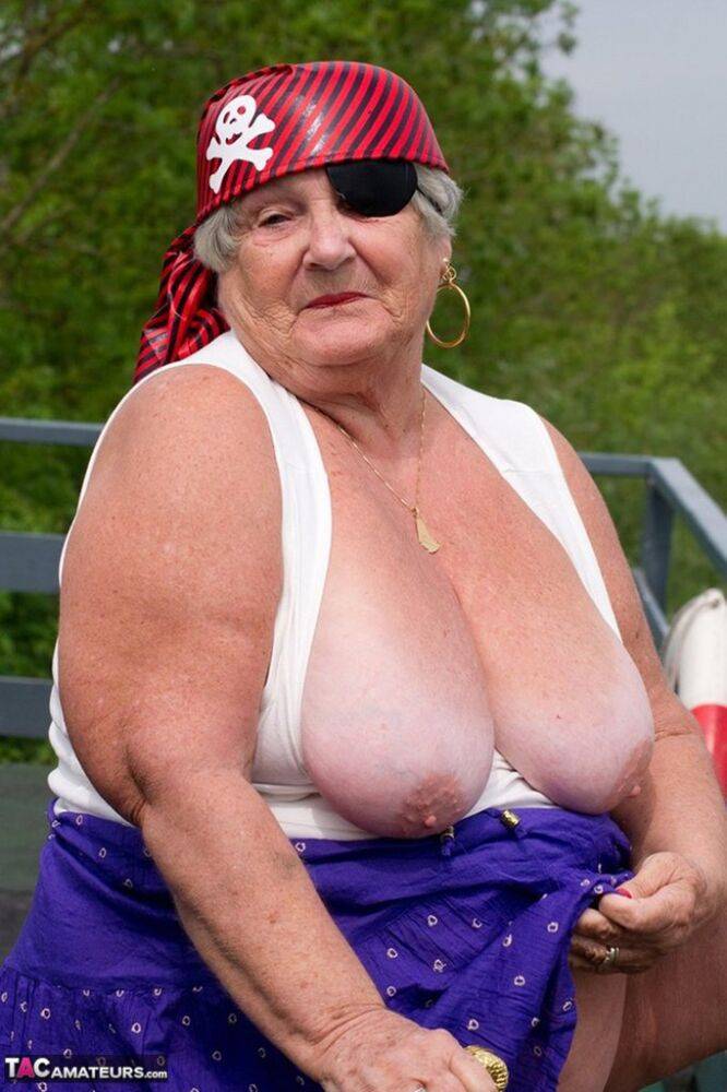 Fat British granny exposes herself on a bridge while sporting pirate attire - #16