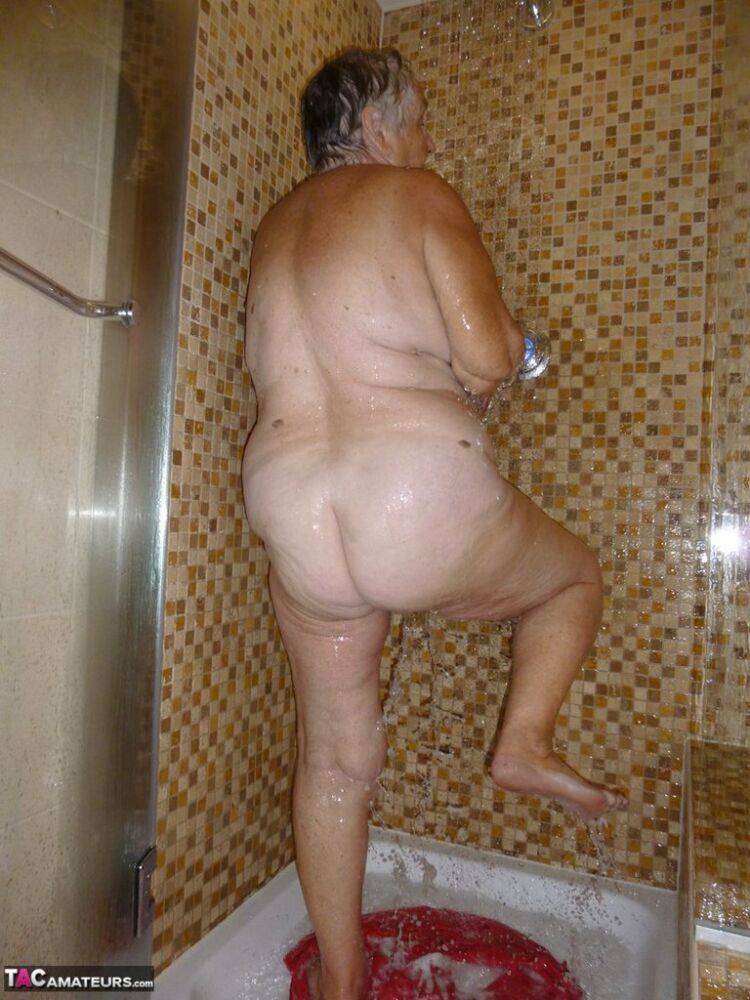 Fat old woman Grandma Libby blow dries her hair after showering - #12