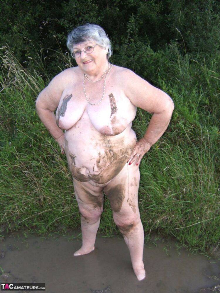 Fat nan Grandma Libby steps into a puddle before covering herself in mud - #10