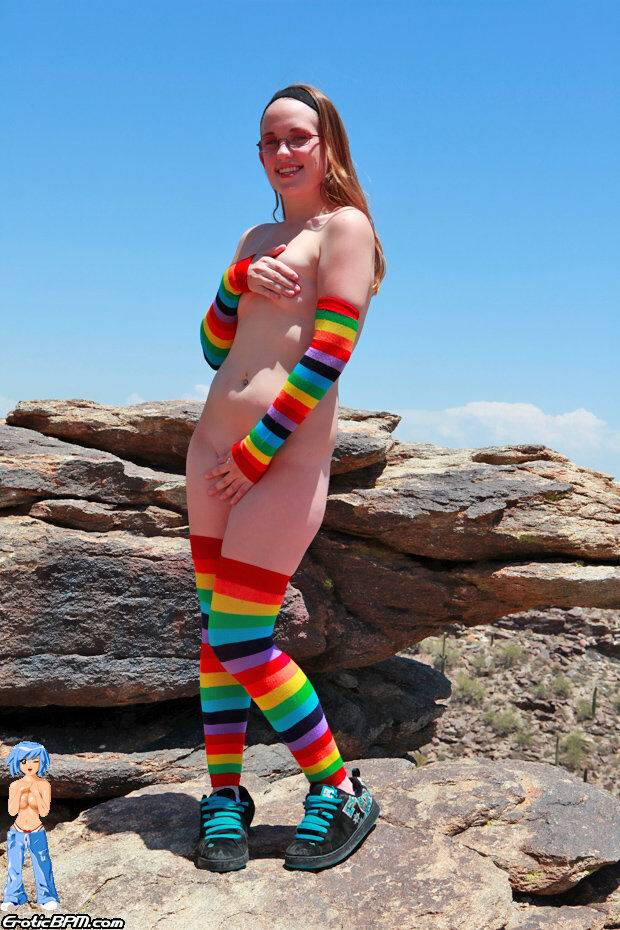 White teen Bunny strips to multi-colored arm and legs socks on an outcrop - #15