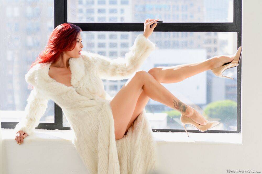 Beautiful Asian woman Tera Patrick removes a white fur coat to pose nude - #5