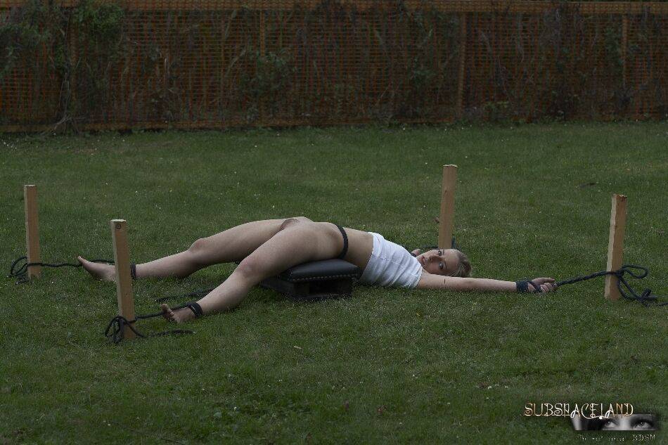 Young blonde girl is tortured in the backyard by her captor - #10