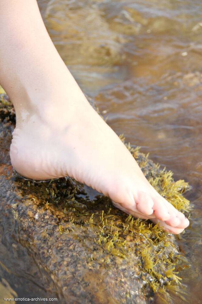 Blonde beauty Garcia gets herself wet on the rocky shore wearing a white - #16