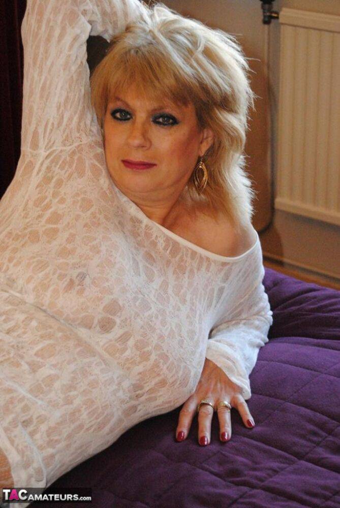 Hot mature Dimonty lounges with legs spread in sheer white lace lingerie - #1