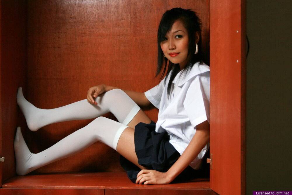 Asian schoolgirl strips to white thigh highs before showcasing her tight slit - #9