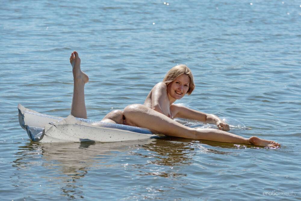 White teen Mak heads into the water with an air mattress while totally naked - #7