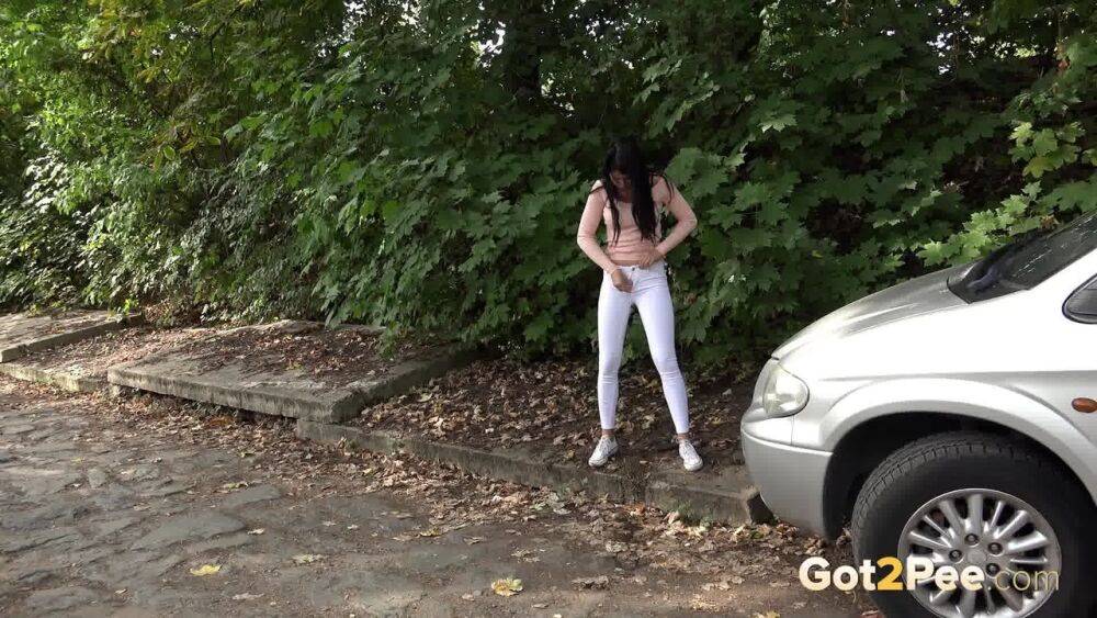 Dark haired girl Dee pulls down her white leggings for quick pee behind bushes - #3