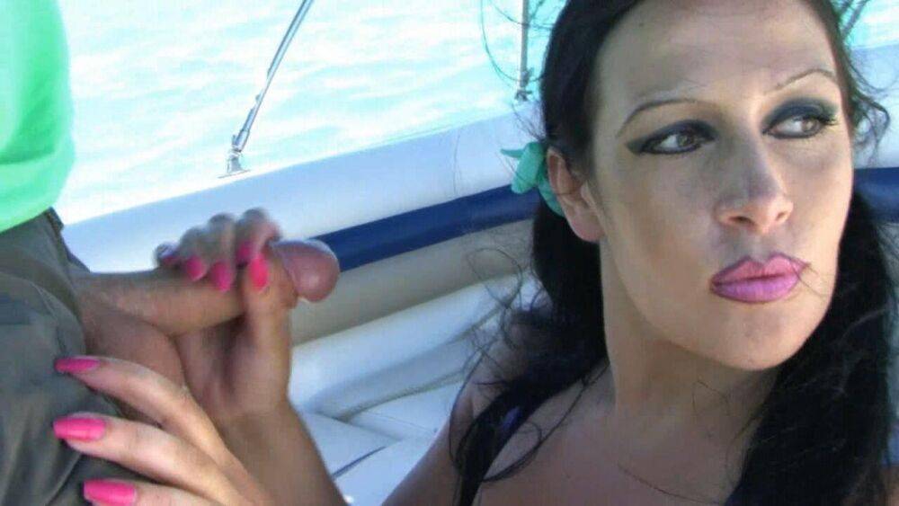 Busty brunette Lady Angelina sucks off a white cock while on a boat - #15