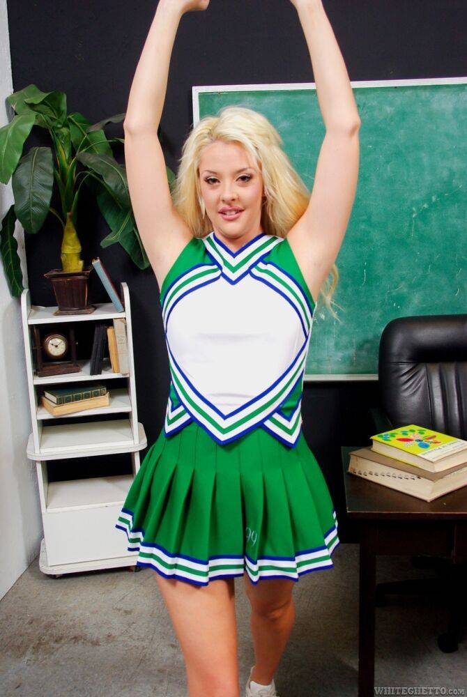 Blonde babe Courtney Taylor flashing upskirt MILF panties in cheer uniform - #14