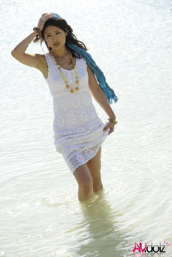 Asian girl wander into the ocean to her knees in a white dress - #5