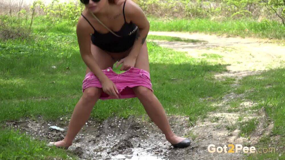 White girl Dafne pisses in a mud puddle while out for a walk in sunglasses - #8