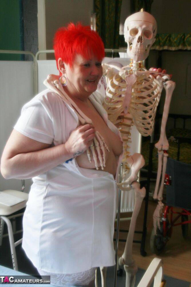 Slutty mature nurse in white stockings gets toyed up by a skeleton - #3