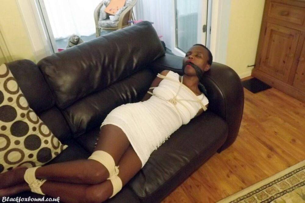 Black female is left tied and cleave gagged in a white dress on a leather sofa - #4