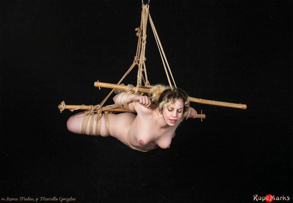 Naked white girl Kama Medea is suspended by ropes while anally hooked - #14