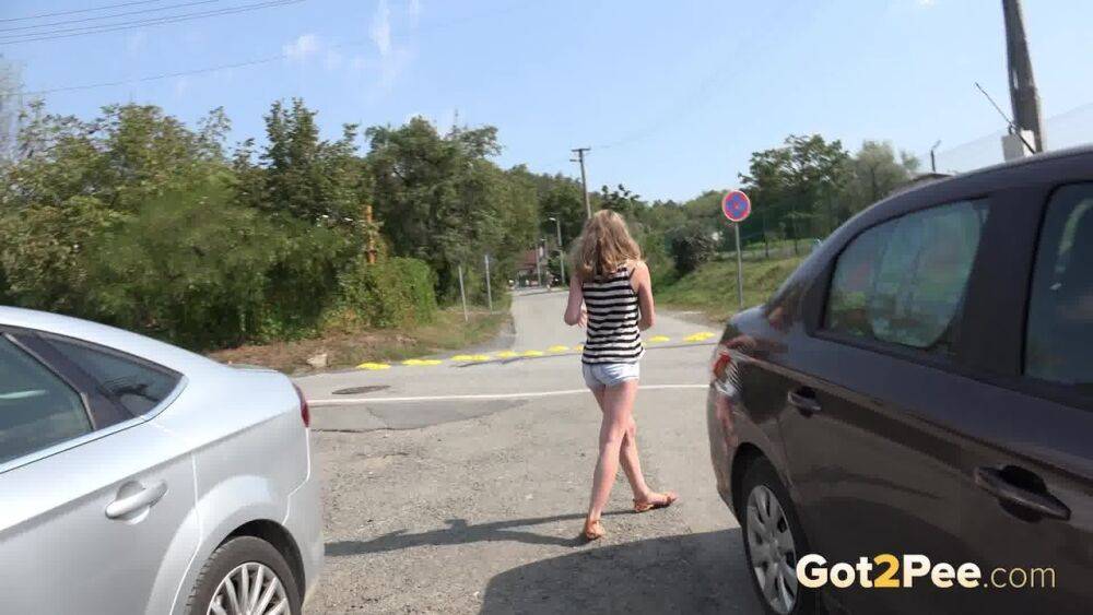 White girl Lolita pulls down her shorts for a quick pee between parked cars - #9