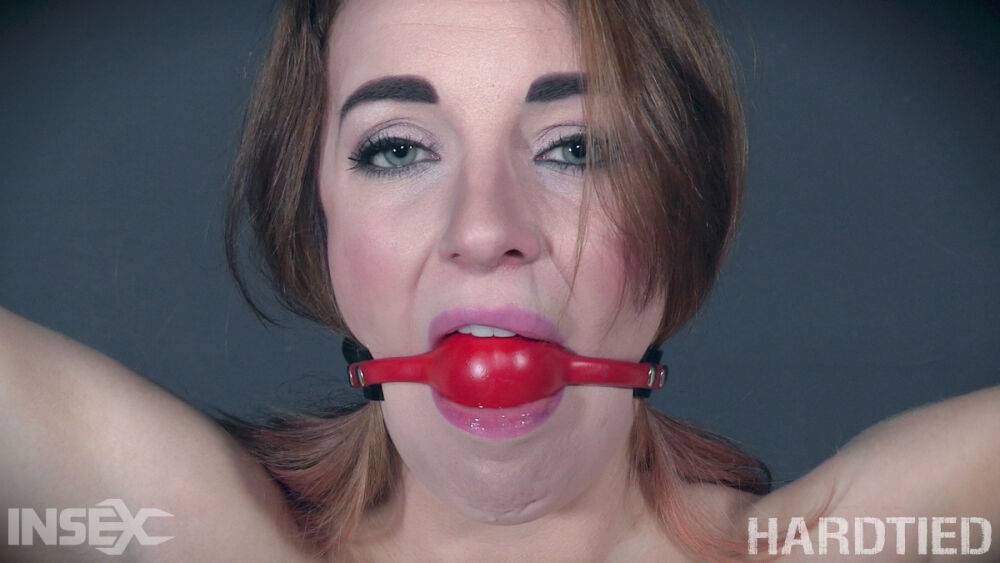 White teen Kate Kenzi has a ball gag removed before a rope suspension scene - #12