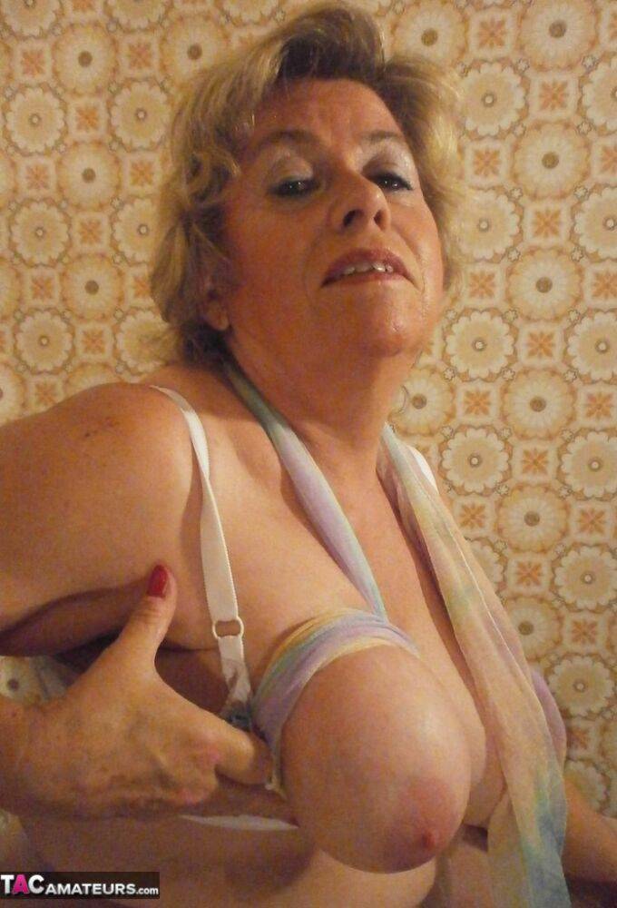 Old woman Caro shows her big natural tits in white pantyhose - #8