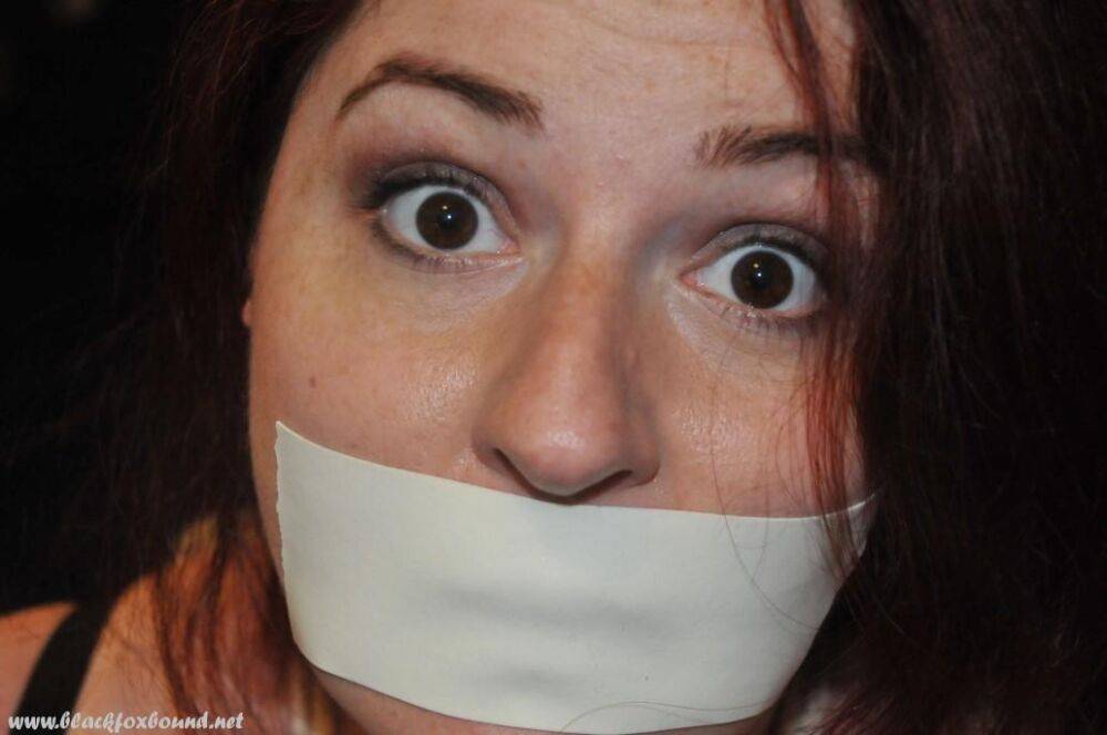 White girl is silenced with medical tape while tied up in her clothing - #7