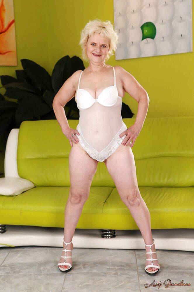 Salacious granny with big flabby tits stripping off her white lingerie - #10