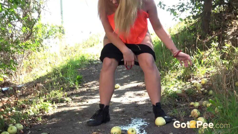 White girl Loreen exposes her bald twat while squatting for a pee in the woods - #2