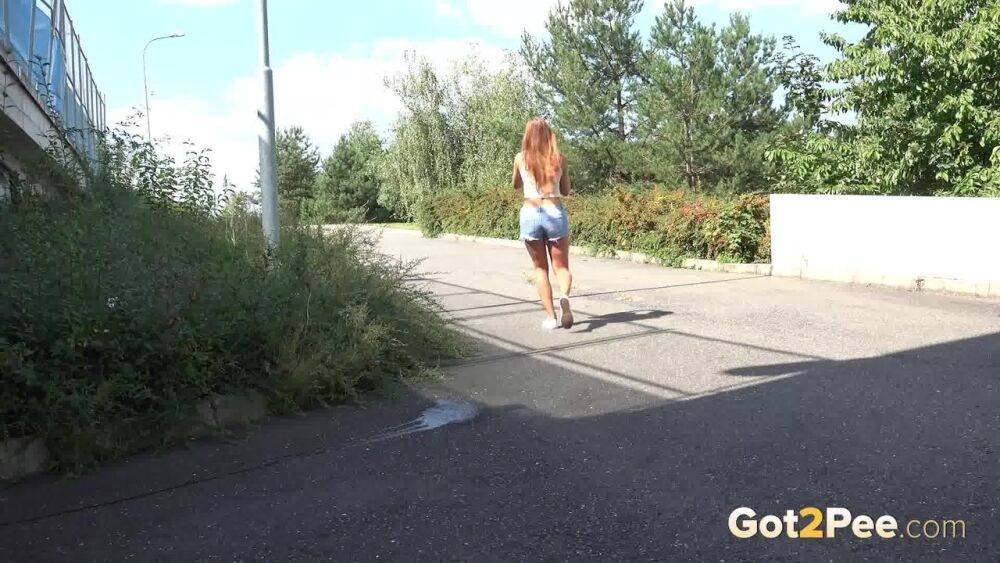 White girl Lucka pulls down jeans shorts for a pee on the side of a road - #2