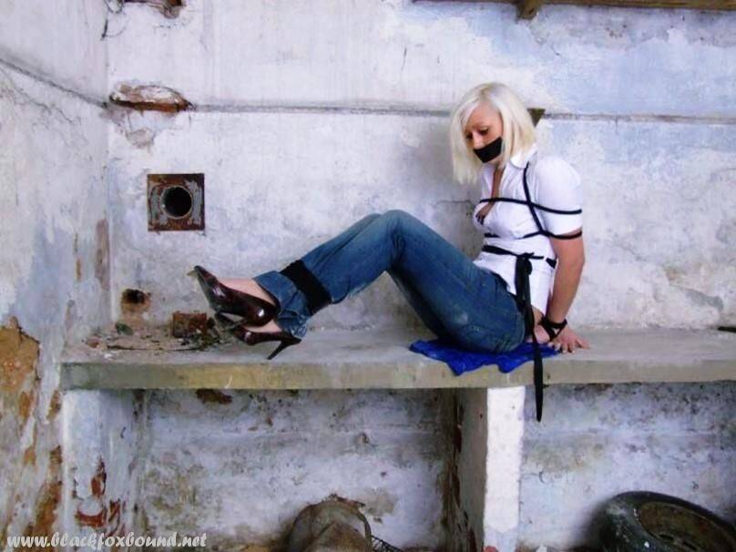 British woman is tied up and gagged in blue jeans and a white shirt - #4