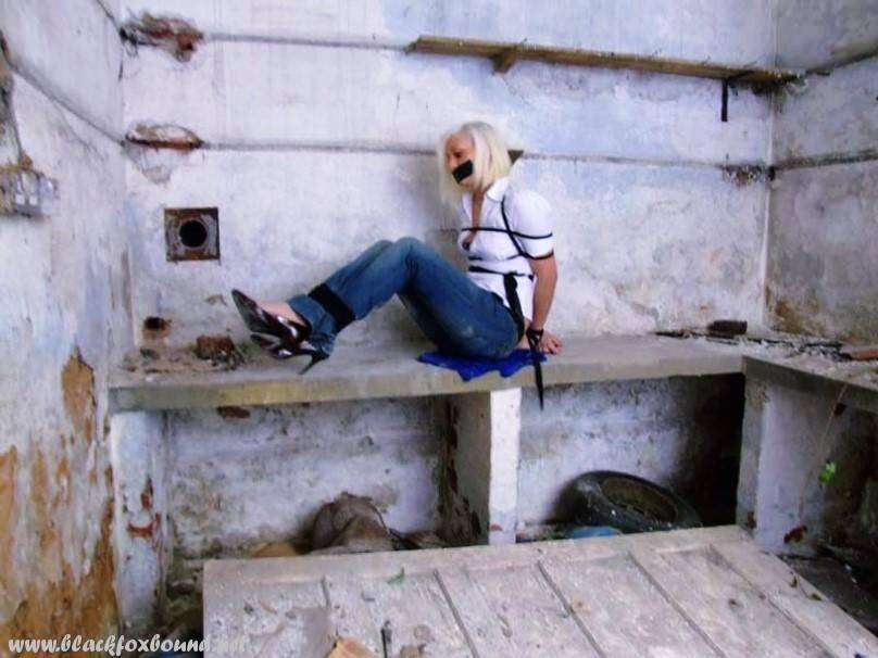 British woman is tied up and gagged in blue jeans and a white shirt - #14