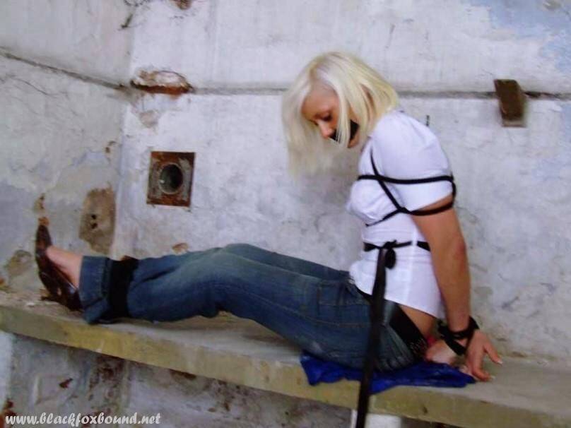 British woman is tied up and gagged in blue jeans and a white shirt - #1