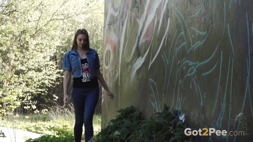 White girl Viktoria pulls down her jeans to take a pee near a wall of graffiti - #7