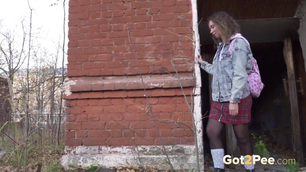 White girl Rita bares her bum while taking a piss by an abandoned building - #3