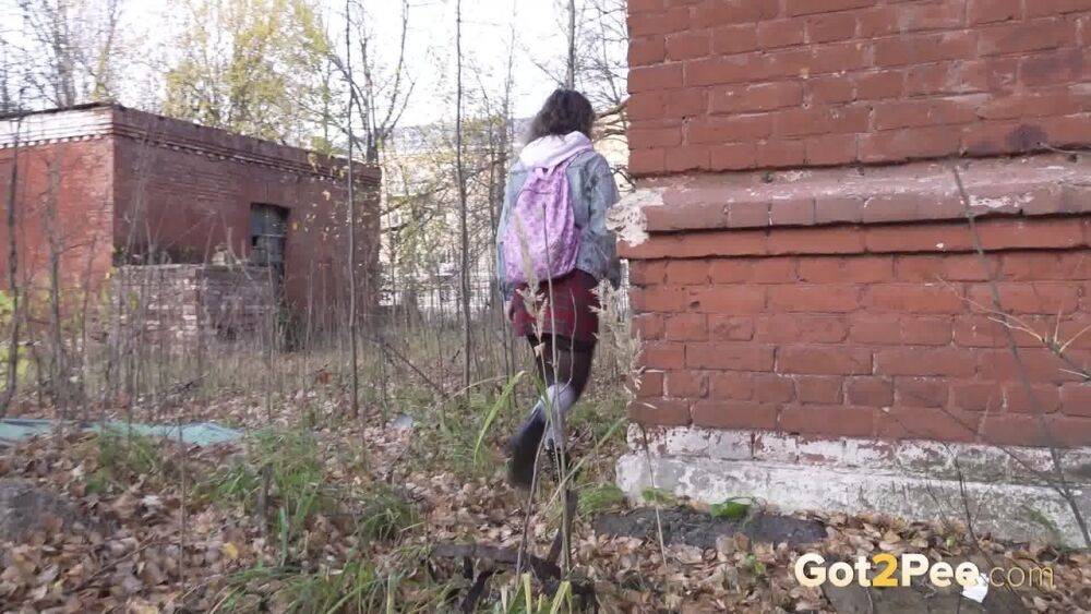White girl Rita bares her bum while taking a piss by an abandoned building - #9