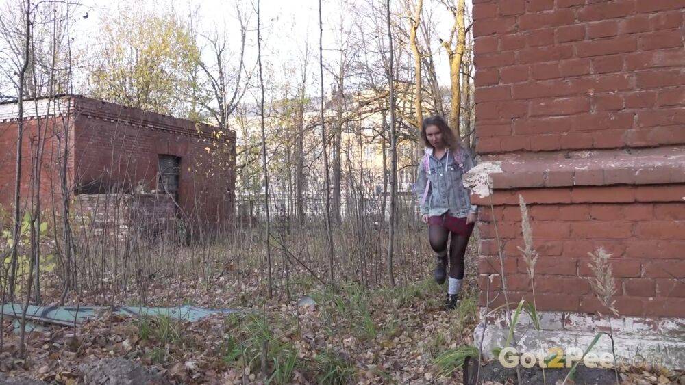 White girl Rita bares her bum while taking a piss by an abandoned building - #7